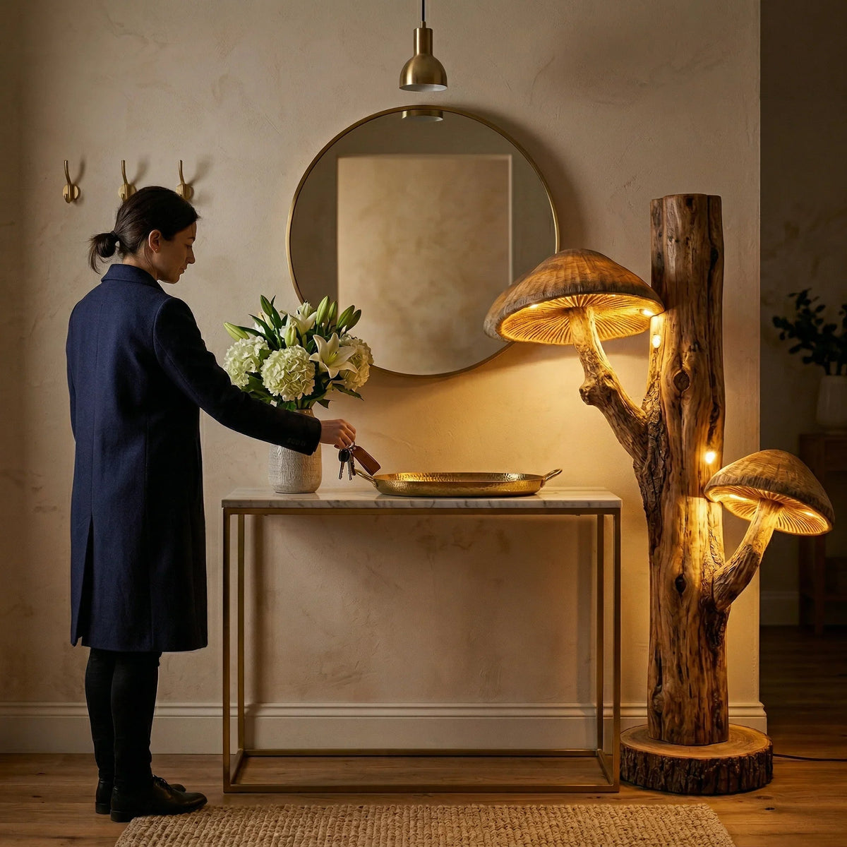 Dual mushroom floor lamp with glowing carved wood caps on natural tree trunk base in entryway